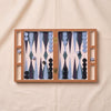 Lacquered backgammon set in blue by Printworks, open and seen from directly above