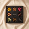 Lakrids Selection Box with eight flavours in a nine-well tray, by Lakrids by Bülow