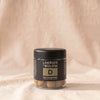 Lakrids D Salt and Caramel chocolate-coated licorice in its black tub, by Lakrids by Bülow