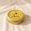 Rose multi-purpose balm in its printed mustard yellow tin by Féret Parfumeur