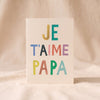Je T'aime Papa card by Mr. Boddington's Studio, the lettering spaced across the card, on a natural cotton backdrop
