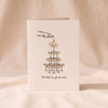 Champagne Tower letterpress card by Dahlia Press on a natural cotton backdrop