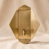 Quatrefold Candle Sconce on a natural cotton backdrop