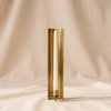 Channel Wall Sconce with a taper candle, on a natural cotton backdrop