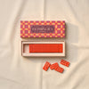 Bazaar dominoes set by Printworks on a natural cotton backdrop