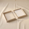Embroidered photo album Tiny Stories by Printworks shown open on a natural cotton backdrop