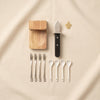 The Essentials oyster and caviar tools by Printworks detail on a natural cotton backdrop