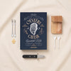 The Essentials oyster and caviar tools by Printworks on a natural cotton backdrop