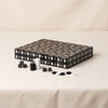 Lacquered backgammon set in black by Printworks closed at an angle