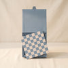 Reverra leather chess set by Printworks with the board shown in the open box on a natural cotton backdrop