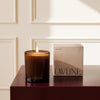 Santal Candle by Lavune with its box, MA VIE studio, burgundy table with cream boiserie