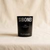 Hypnagogia saffron scented candle by Sibonei on a natural cotton backdrop