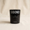 Maslo santal scented candle by Sibonei on a natural cotton backdrop