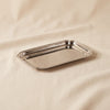 Andrea polished nickel serving tray 12.5 inch by Zodax on a natural cotton backdrop