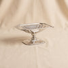 Antique footed dish in polished nickel by Zodax on a natural cotton backdrop