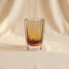 Corvatsch tonal vase in amber and smoke 6.75 inch by Zodax on a natural cotton backdrop