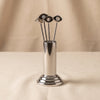 Evil eye cocktail picks set with stand by Zodax on a natural cotton backdrop