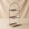 High Tea three tier stand in polished nickel by Zodax on a natural cotton backdrop