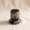 Marbella marble match holder by Zodax in an alternate marble colorway on a natural cotton backdrop