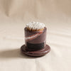 Marbella marble match holder by Zodax on a natural cotton backdrop