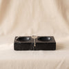 Marble salt and pepper dish in black by Zodax on a natural cotton backdrop