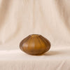 Milano cut and frosted vase in amber by Zodax on a natural cotton backdrop