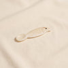 Mother of pearl caviar spoon by Zodax on a natural cotton backdrop