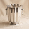 Orleans polished nickel wine and champagne bucket by Zodax on a natural cotton backdrop