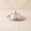 Parisian nickel butter dish by Zodax on a natural cotton backdrop