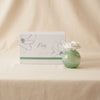 Petals porcelain diffuser in Capri Citrus Flower by Zodax on a natural cotton backdrop