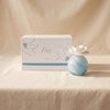 Petals porcelain diffuser in Water Lotus by Zodax on a natural cotton backdrop