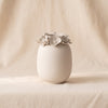 Petite Couronne bone china vase by Zodax on a natural cotton backdrop